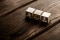 The picture shows three wooden cubes with symbols for laws and regulations