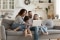 Family on a sofa with a computer 