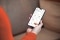 The image shows a hand with a smartphone and the ViCare app open as a symbol for Vitopure control via app.
