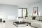 The picture shows a modern room with a wall convector as the electric heater.