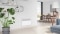 The picture shows the Vitoplanar EC4 electric heater in the living room of a modern house.
