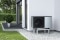 Vitocal 222-A heat pump on the house wall next to the patio. Plant troughs on top.