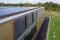 A building with solar panels on the flat roof and façade